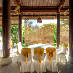 Elegant pavilion setting with decorated tables and chairs, perfect for events.