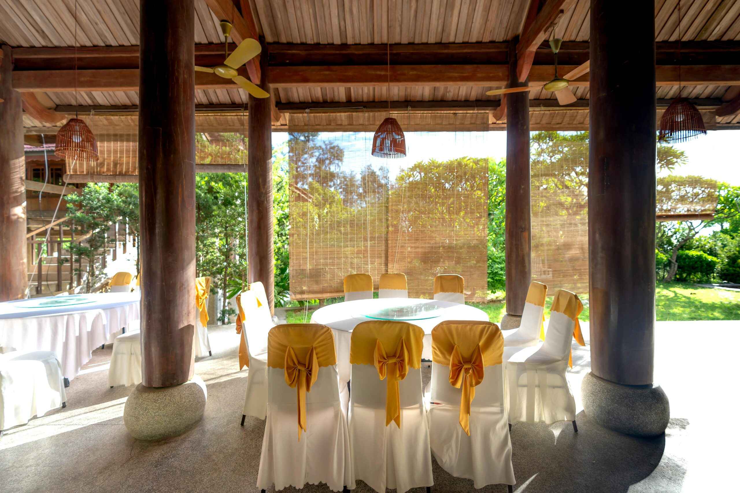 pexels photo 14025854 14025854 Elegant pavilion setting with decorated tables and chairs, perfect for events.
