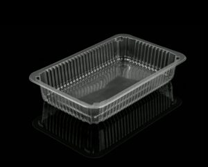 Empty clear plastic food container with reflections against a black background.
