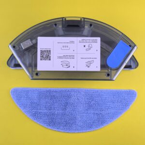 Cleaning robot water tank and mop on yellow backdrop, showcasing household appliance detail.