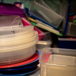A variety of plastic storage containers stacked together, ideal for organizing kitchen spaces.