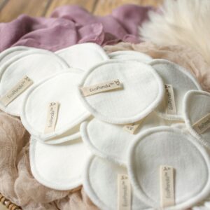 Eco-friendly reusable cotton pads in a basket, promoting zero-waste living.