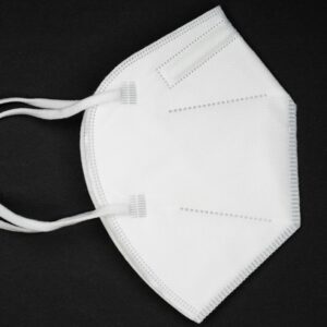 A white KN95 face mask against a black background emphasizing health protection.