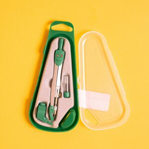 Green geometry compass in a plastic case on a vibrant yellow background.