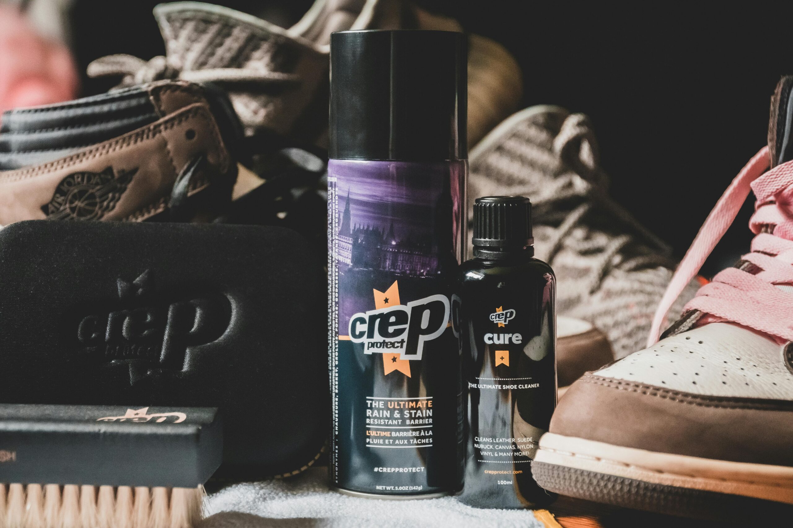 pexels photo 7500608 7500608 Closeup of set of various types of products for shoes care in bottles and brush for cleaning footwear from dust and dirt